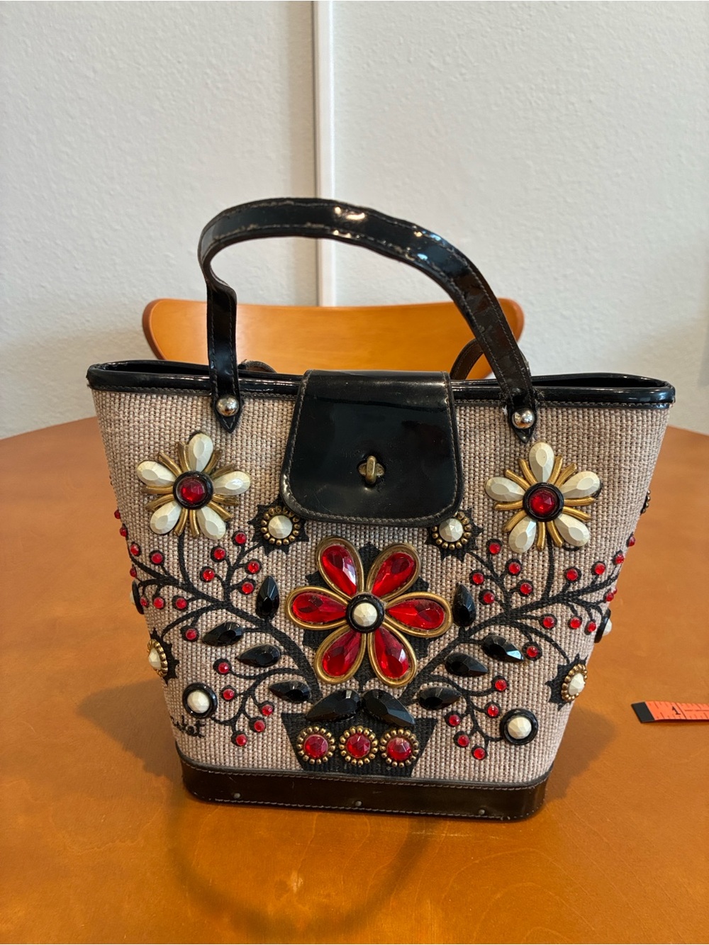 Embroidered Straw Tote with Black Trim and Red Accents